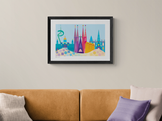Iconic Barcelona art print framed in black on a pale grey wall.
