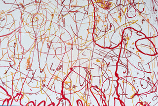 Section of an original painting showing ribbons of red and yellow paint intersecting and filling a white canvas.