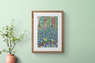 Woodland scene with birds art print by South Island Art hanging on a pale green wallpapered wall.