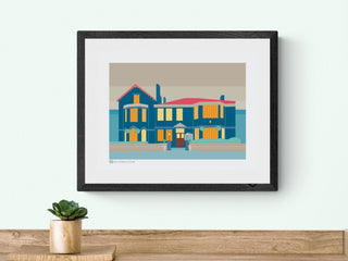 Framed illustration of Balham Bowls Club by South Island Art. The print is hanging on a light green wall.