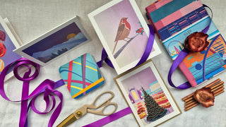 Christmas cards, coasters and a tea towel illustrated in a bold, graphic style.